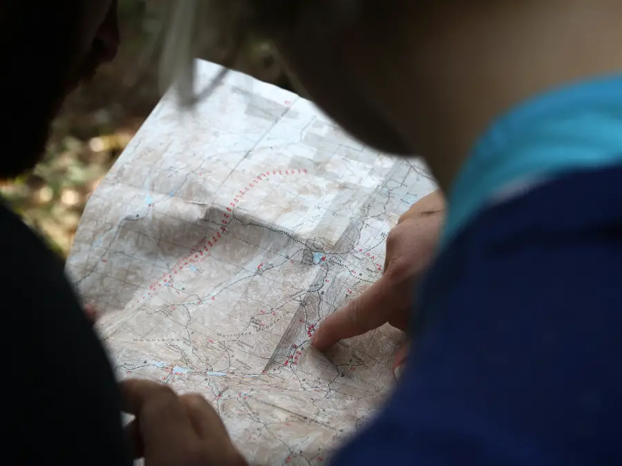 someone-searching-location-on-map